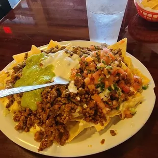 Super nachos with 1/2 asada and 1/2 chorizo
