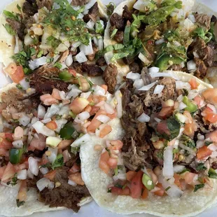  two tacoss with various toppings