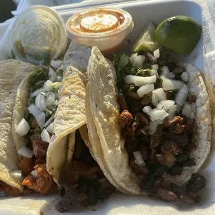 4 tacos. 2 chicken, 2 pork