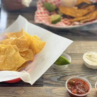Taco birria with a side of chips