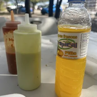 Pina aguas frescas and their 2 sauces salsa and creamy cilantro (I think)