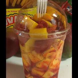 a plastic cup filled with fruit