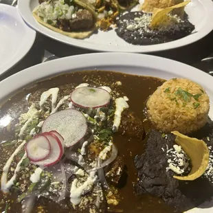 Chicken mole enchiladas, carne asada taco, suadero taco, chicken taco