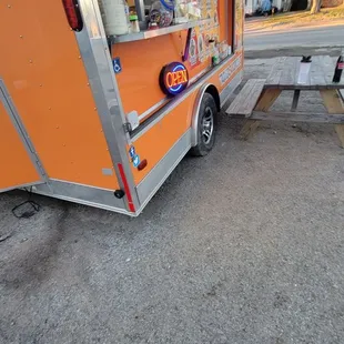 a taqueria truck parked in a parking lot