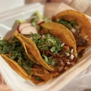 left to right;  1 al pastor, and 2 barbacoa