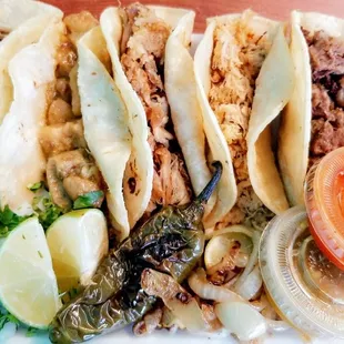 a plate of tacos and salsa