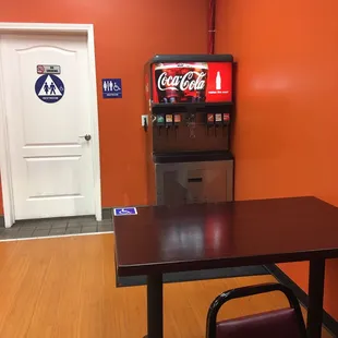 Self service beverage and one restroom.