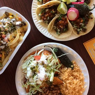 Tacos de asada, enchilada plate, and asada fries.