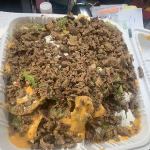 Nachos with Carne asada- not thrilled they use nacho cheese. Cost $19.28  a bit much. Hopefully it tastes good.
