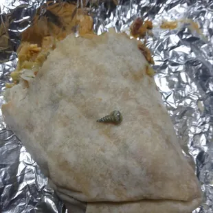 a burrito wrapped in tin foil