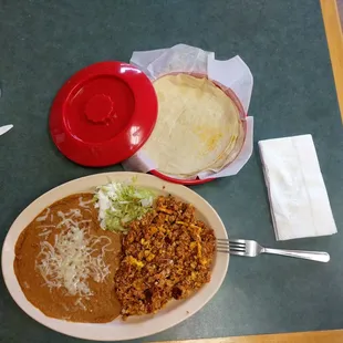 Chorizo and eggs with beans, no rice requested by me.