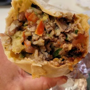 Super carne asada and al pastor burrito with extra meat