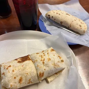 Bacon and egg burrito accompany with a egg and ham taco mmm delicious