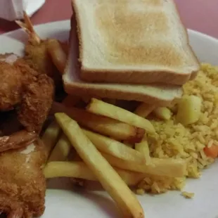 Fried breaded shrimp, french fries, rice and toast
