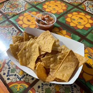 Complimentary chips and tiny salsa