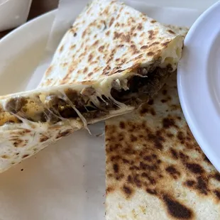 The Quesadilla Gigante Steak -asada (comes with a sour cream sauce)