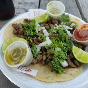 Bistec (steak) tacos home made corn tortilla.