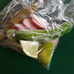 Mixed bag to go with a couple tacos. Serrano chili (fresh and pickled), radish, and limes!