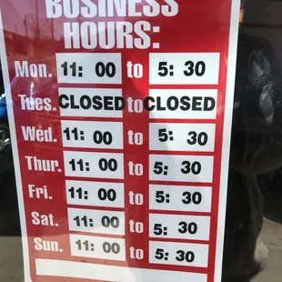 a business hours sign