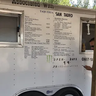 a man ordering food from a food truck