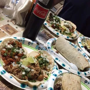 Tacos starting from the left: el pastor, pollo, &amp; carnitas. Gordita in bottom right, burrito in middle &amp; of course Coca Mexicana