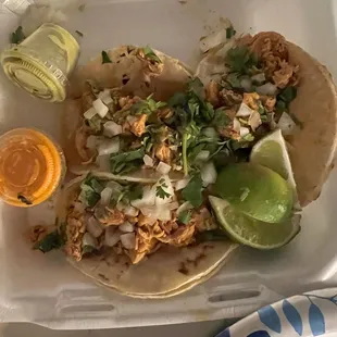 Pollo chicken tacos with cilantro and onion