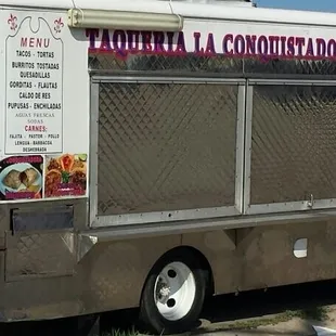 taco truck parked alongside the back wall