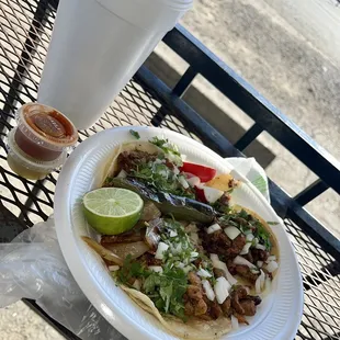 Three el pastor tacos and a horchata