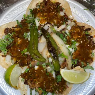 Pastor tacos with spicy red salsa
