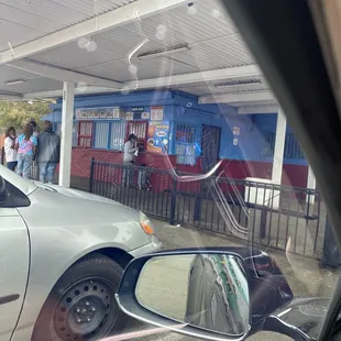 the reflection of a car in a side mirror