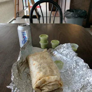 a burrito wrapped in tin foil