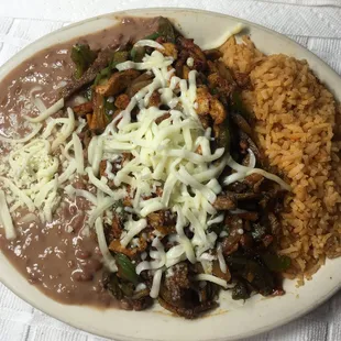 Fajita Made with your choice of chicken, steak  or mixed, bell peppers, mozzarella  cheese, rice and beans.