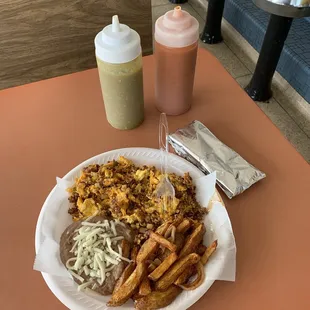 Chorizo &amp; eggs, refried beans, and fried potatoes and onions - breakfast menu.
