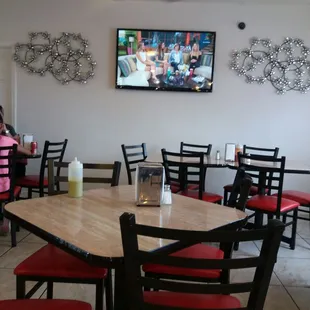 a dining area with a flat screen tv