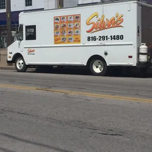 a taqueria truck parked on the side of the road
