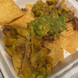 Chicken nacho supreme my ass no sour cream no chives no jalapeños nothing but stale chips and chunks of chicken