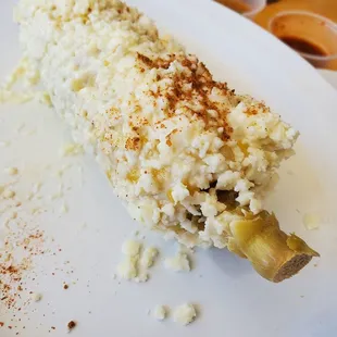 a piece of corn on a plate