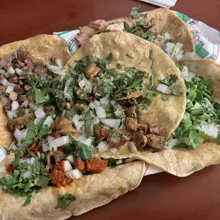 (From bottom left clockwise): pastor, tripa, pechuga tacolare, brisket, tripa (if my memory serves me correct)
