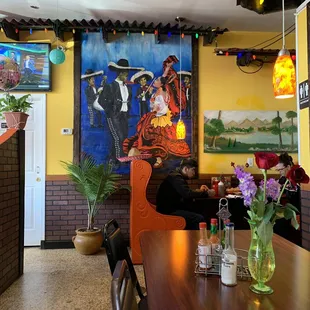 Dining area and mural.