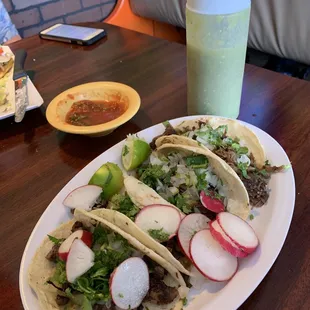 Traditional style Carne Asada  (steak) and Barbacoa de Borrego (lamb stew) tacos (2 ea.)