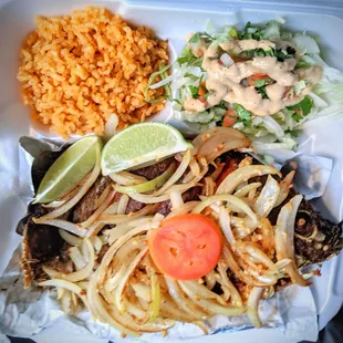 Fried whole fish with rice and salad