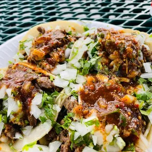 a plate of tacos on a table