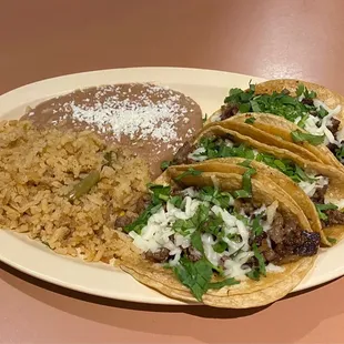 Steak tacos with rice and beans