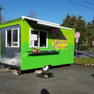 a taqueria on the corner of a street