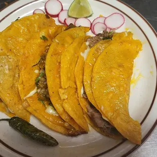 three tacos on a plate