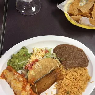 Combo plate with chips &amp; salsa and a large orange juice