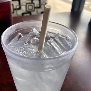 Delicious agua de limón with a paper straw