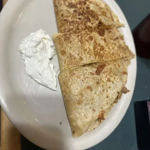 Chicken quesadilla lot of meat and very cheesy.