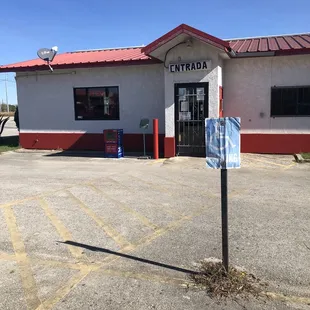 a sign in front of a building