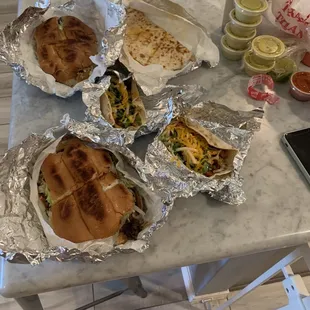 Pork taco, beef taco, beef torta, barbacoa torta, chicken quesadilla.